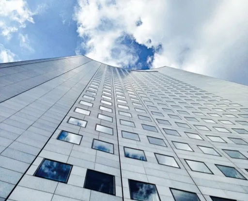 Facade of the Panorama Tower from below with a cloudy sky